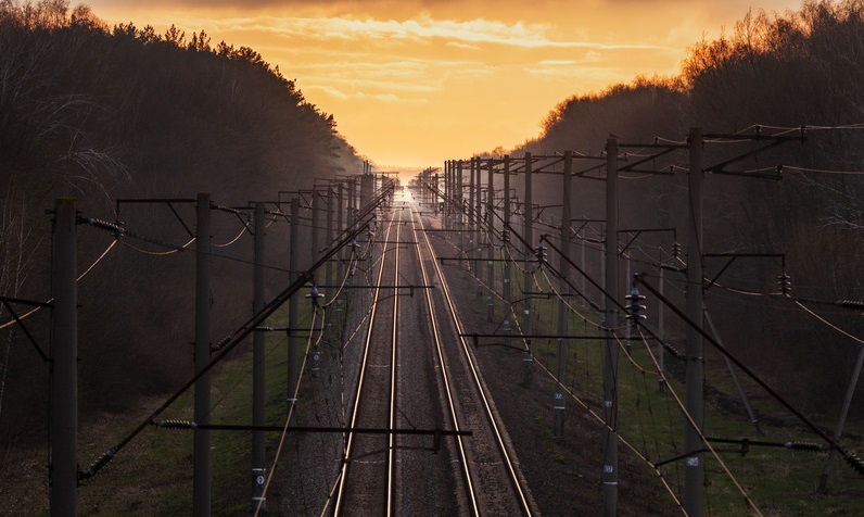 railroad-at-sunset-rail-freight-and-passenger-tra.jpg